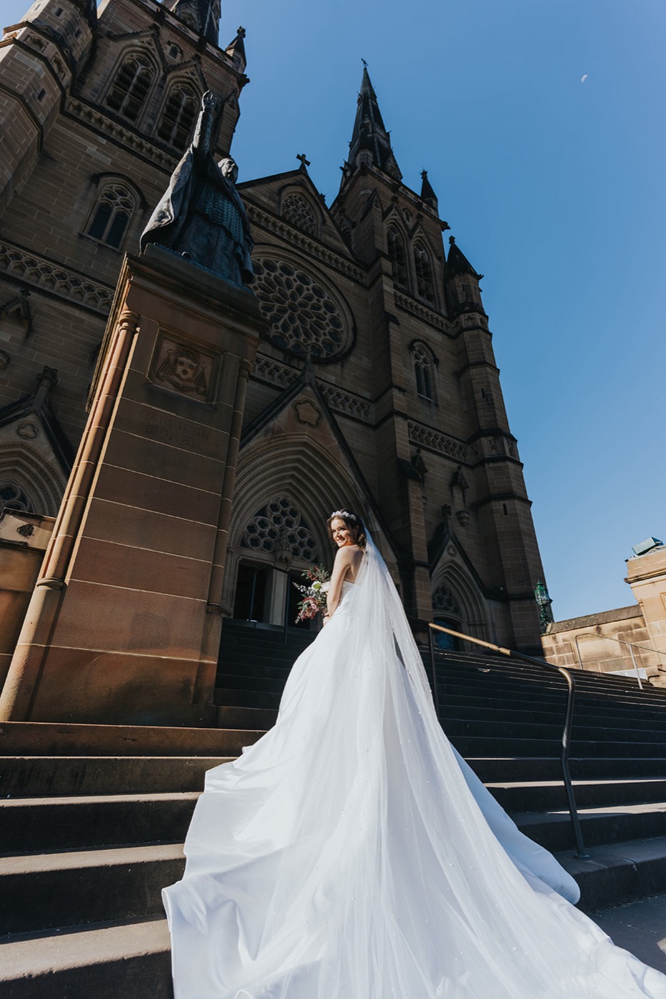 Bride's long train on the cathedral steps