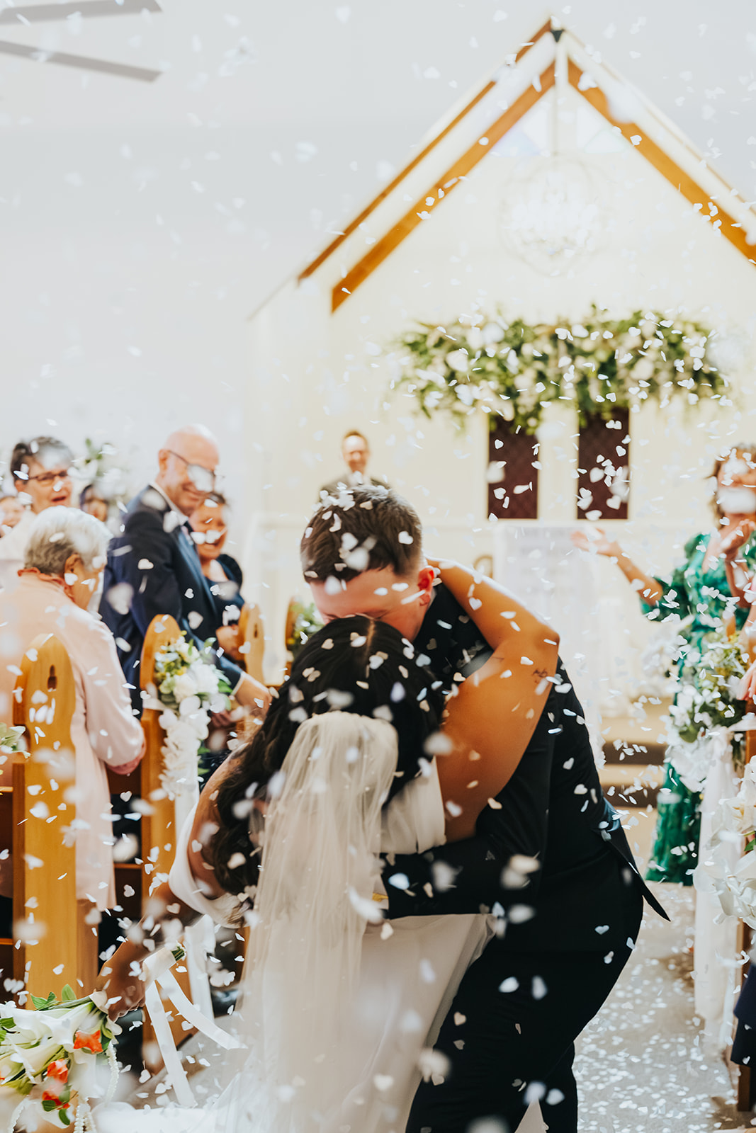 Black and white of the confetti exit at the chapel doors