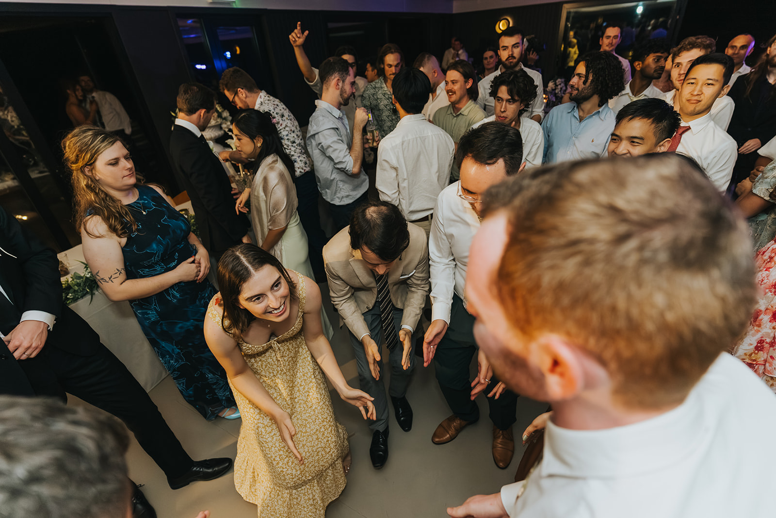 A packed dance floor at the reception