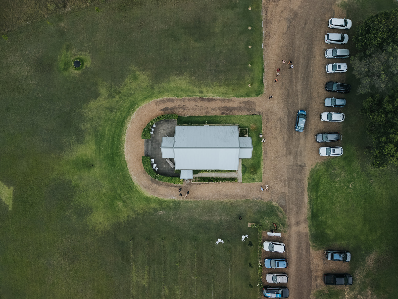 Top-down drone view of the chapel roof and circular driveway
