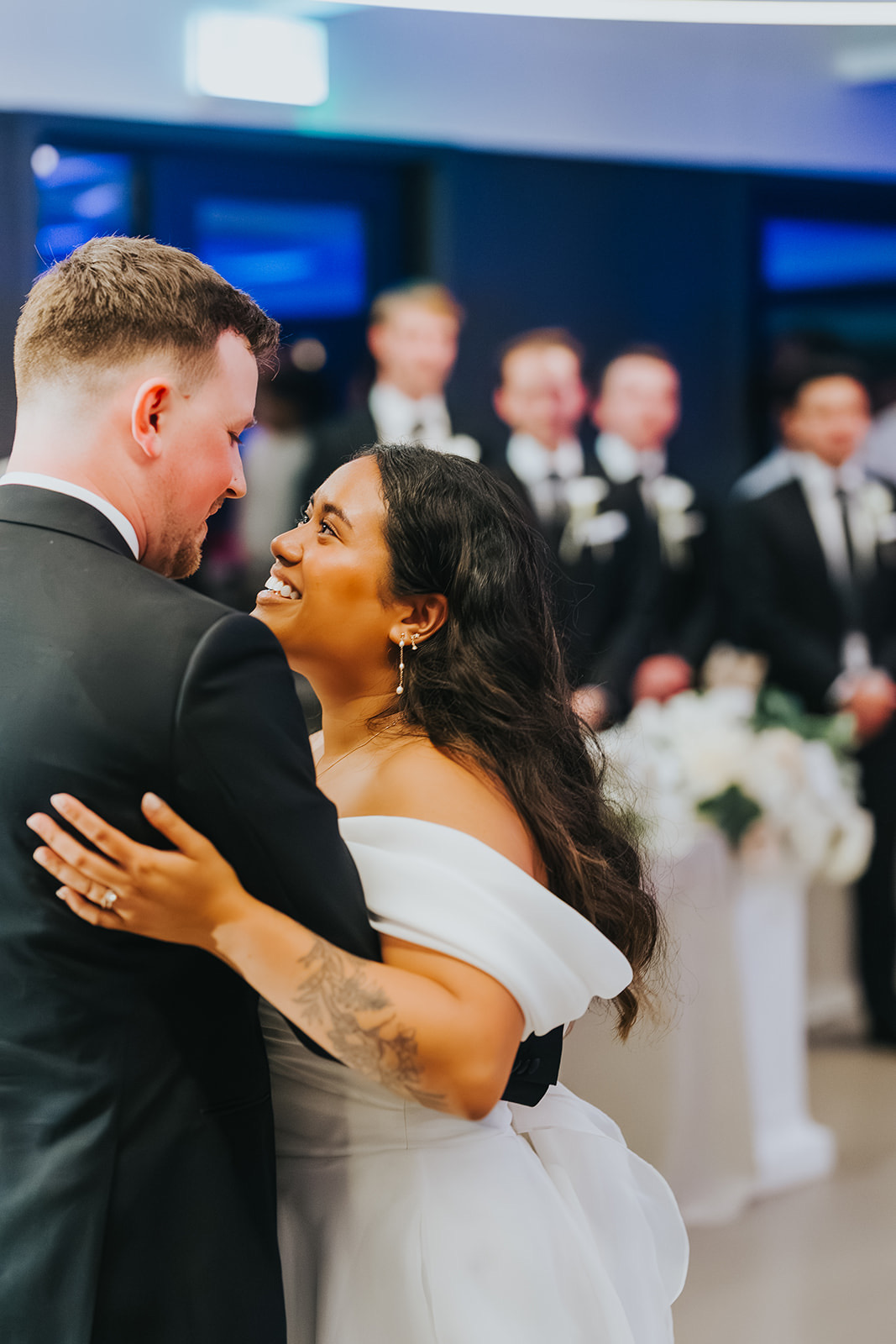 The couple embracing during their first dance