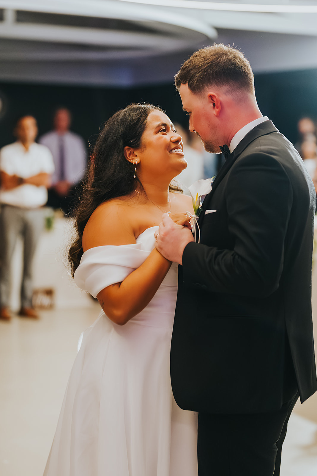 Sophia smiling up at Lachlan on the dance floor