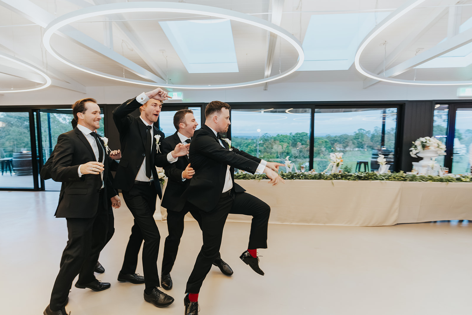 Groomsmen dancing their way into the reception
