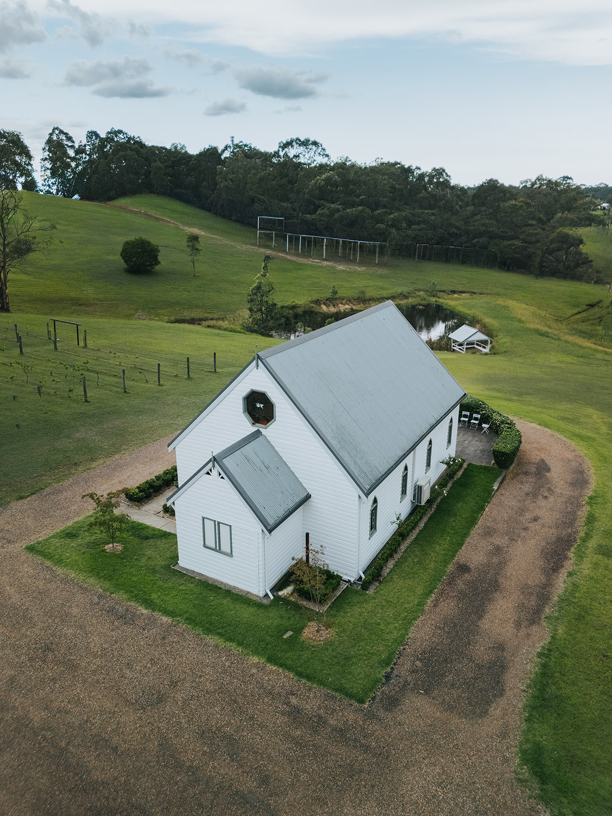Aerial view of the white chapel at La Pera Estate