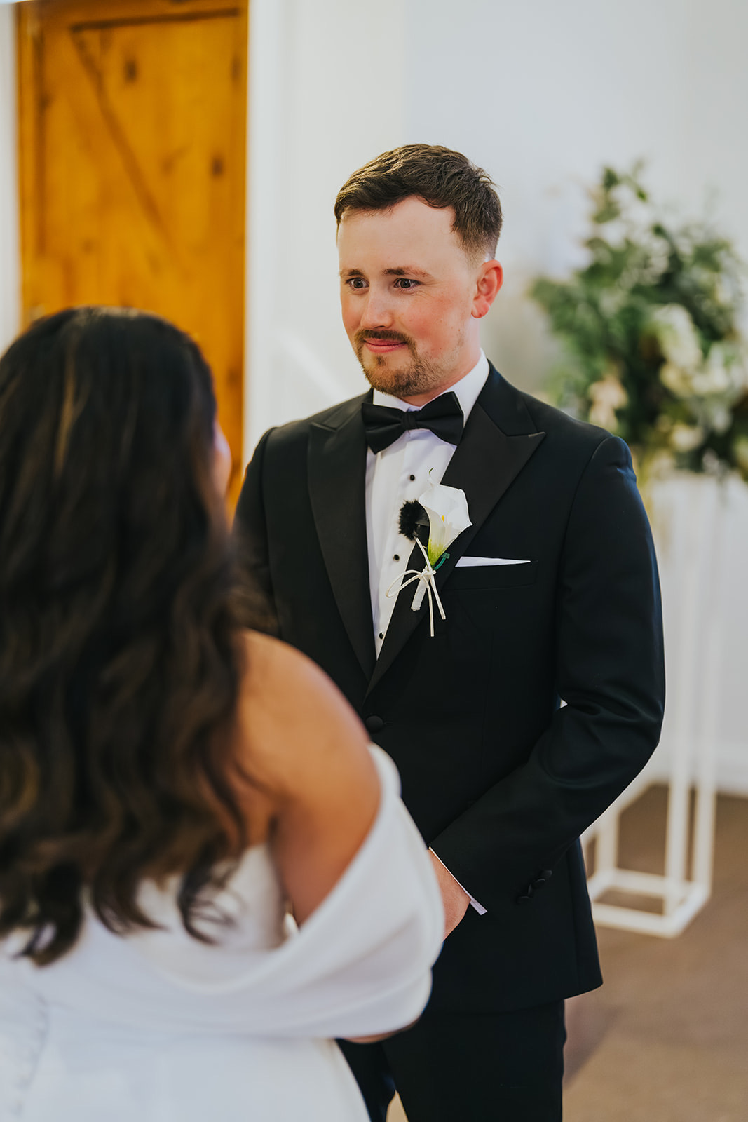 Lachlan listening as Sophia reads her vows
