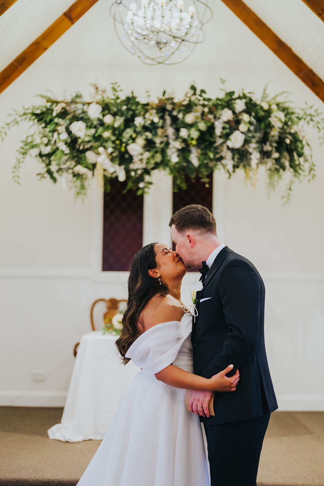 Sophia and Lachlan kissing in the empty chapel
