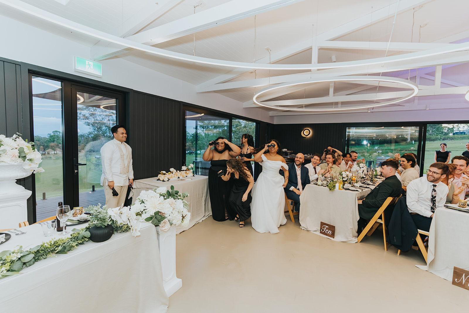 The modern reception room at La Pera Estate with glass doors to the view