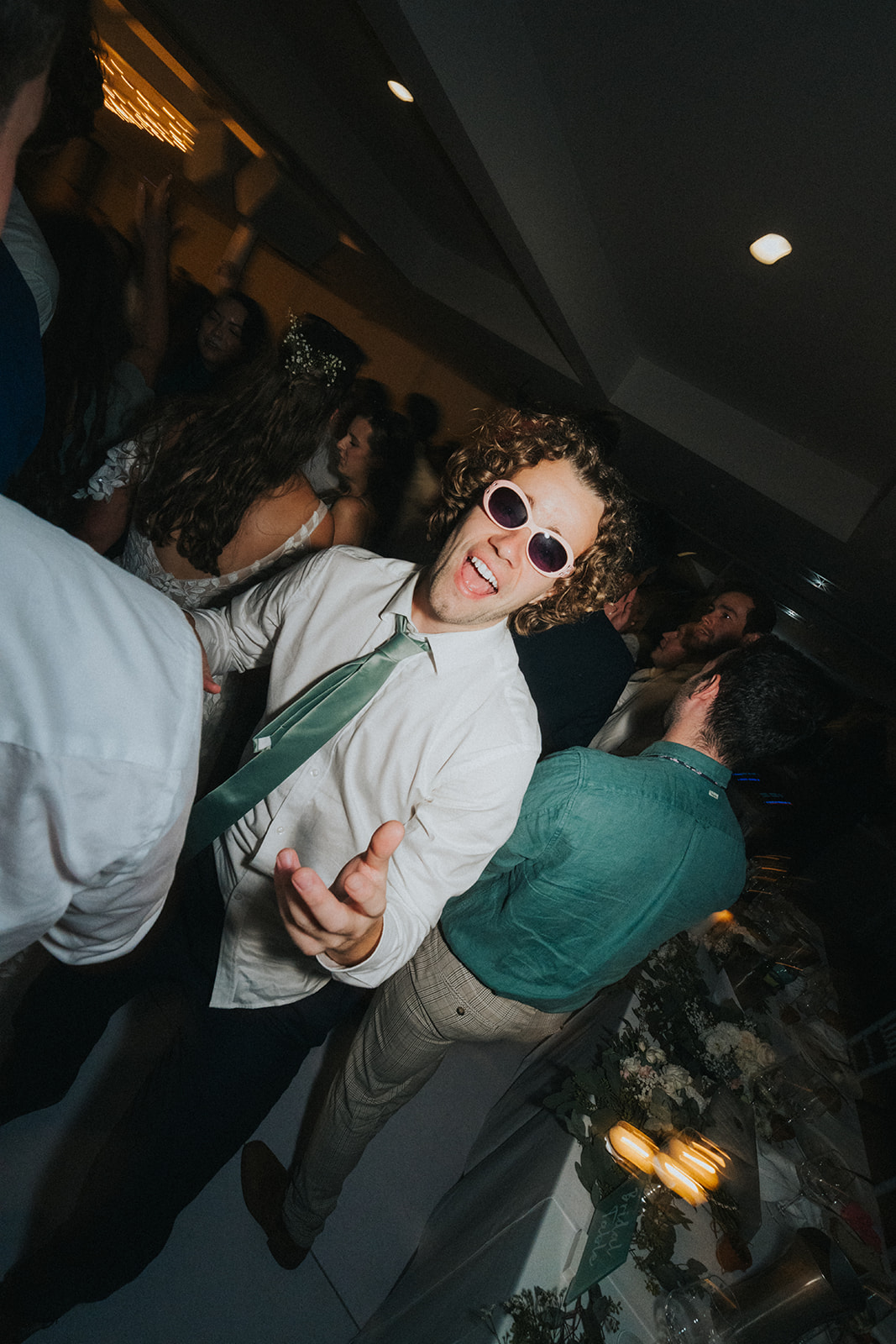 Groomsmen in sunglasses on the dance floor