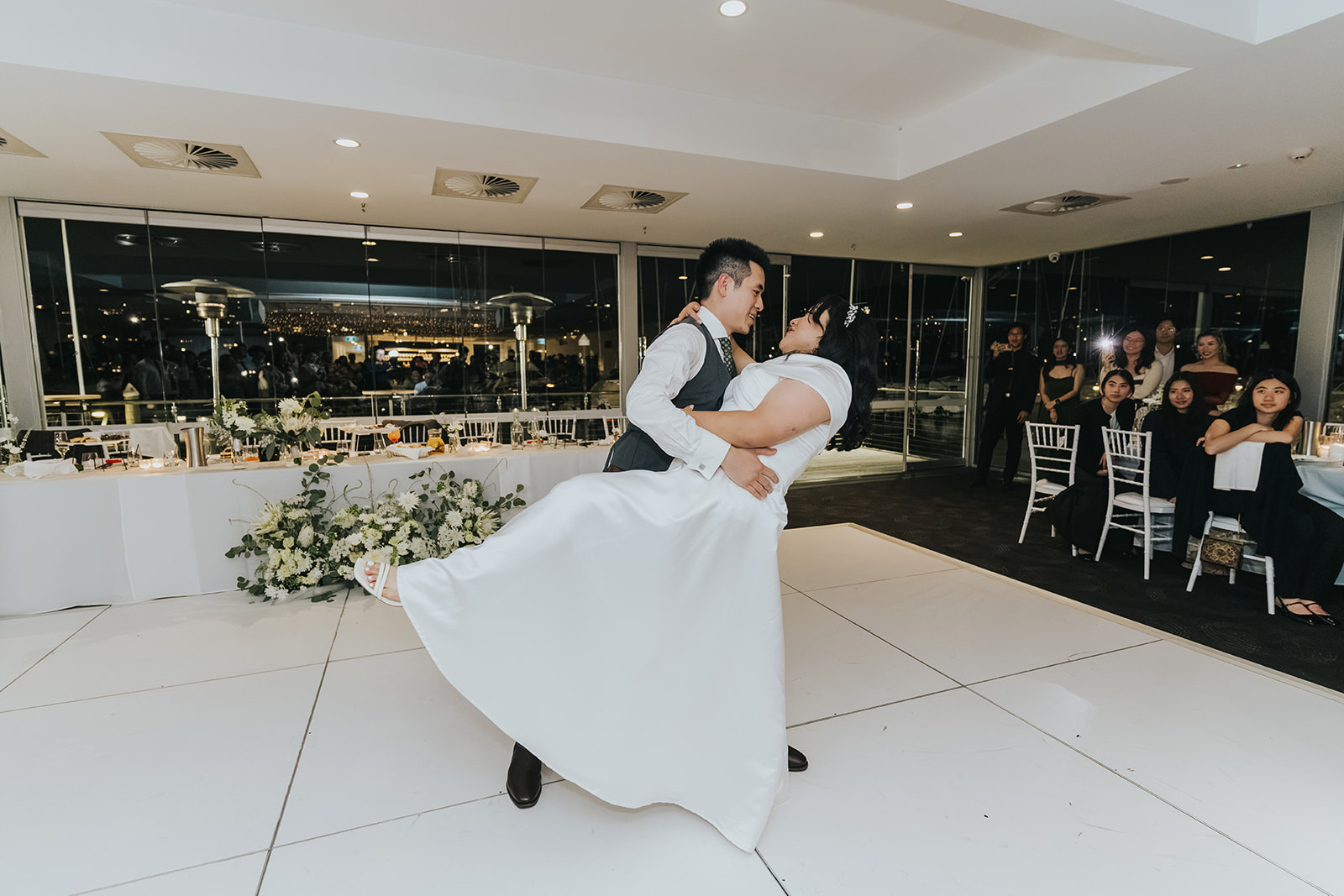 Jimmy dipping Cathy on the white dance floor at Orso Bayside
