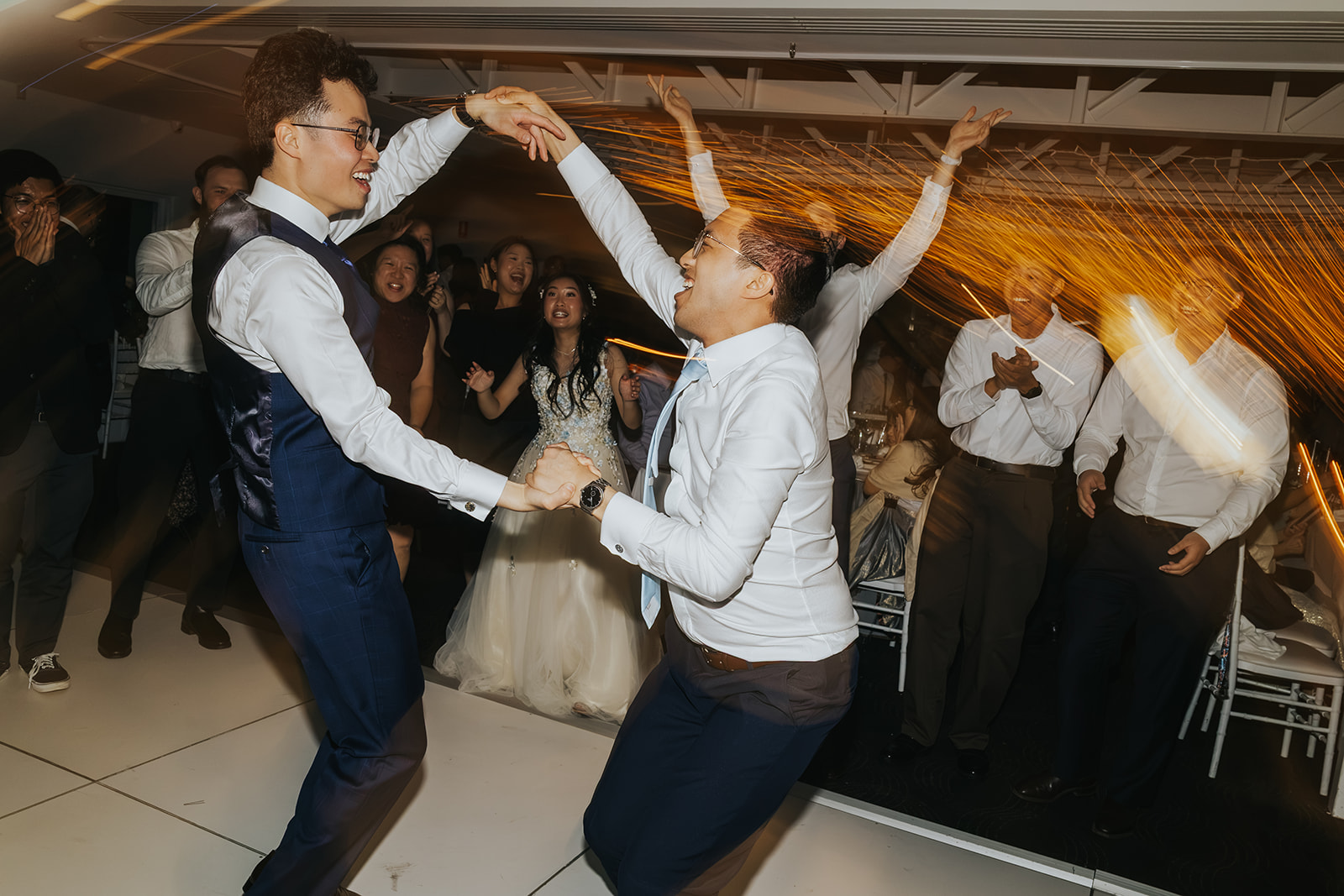 Groomsmen showing off their moves on the dance floor