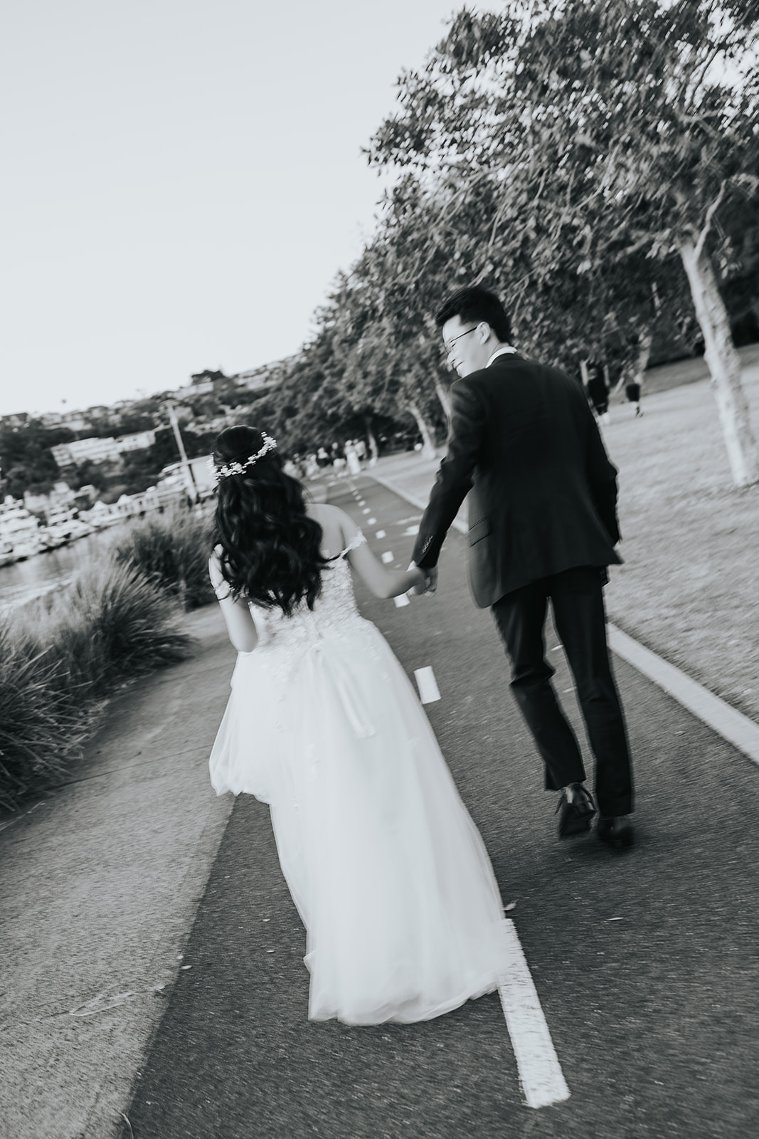 Rabi and Shaphir walking hand in hand along the path at The Spit